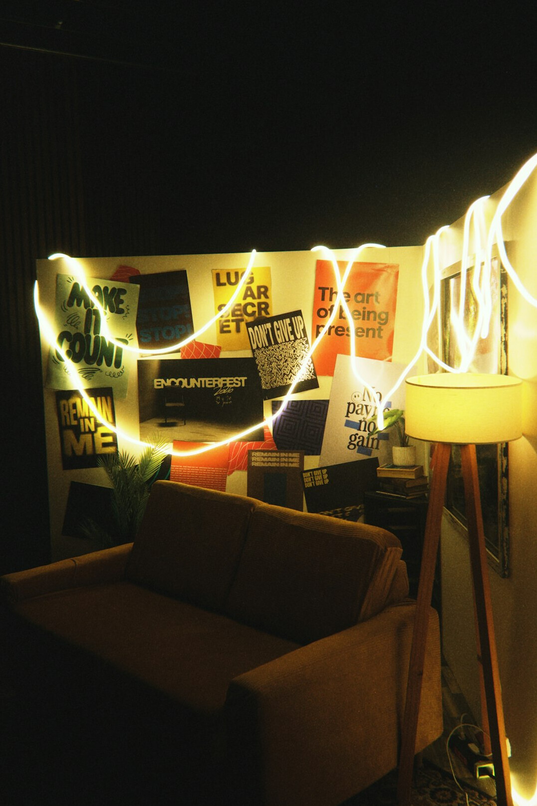 Live show studio set with an illuminated on air sign and a sofa set